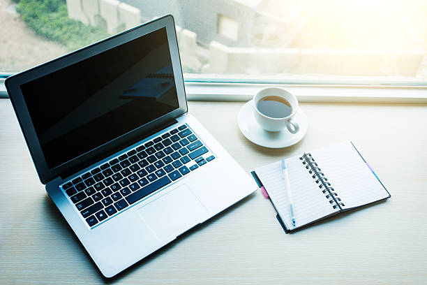 istock Laptop with coffee and notebook on desk 520087692