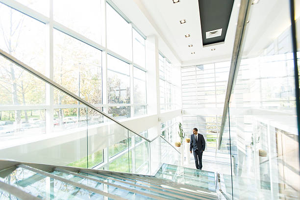 istock Modern black businessman on the stairs 520087904