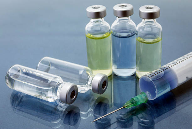 istock Medicine vials and syringe 520088240