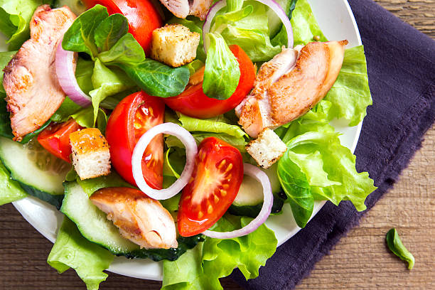 istock Chicken salad with vegetables 520088750