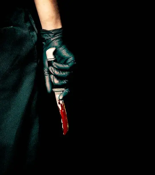 Photo of Black Glove and Bloody Knife