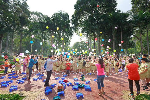 Tao Dan Park, Ho Chi Minh City, Vietnam - March 13, 2016: the images of the scouts when they have outdoor activities in a Tao Dan park in Hochiminh City . scouts they released balloons carrying the dreams