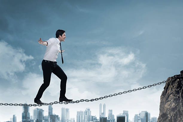 istock Business person balancing on the chain 520091736