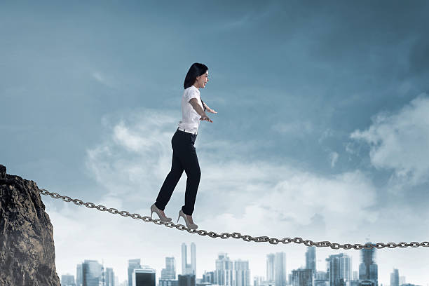 istock Business person balancing on the chain 520091894
