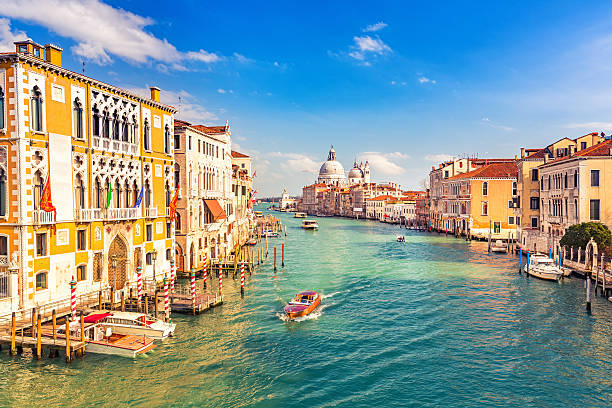 Venice at sunny evening Grand Canal and Basilica Santa Maria della Salute in Venice venice stock pictures, royalty-free photos & images
