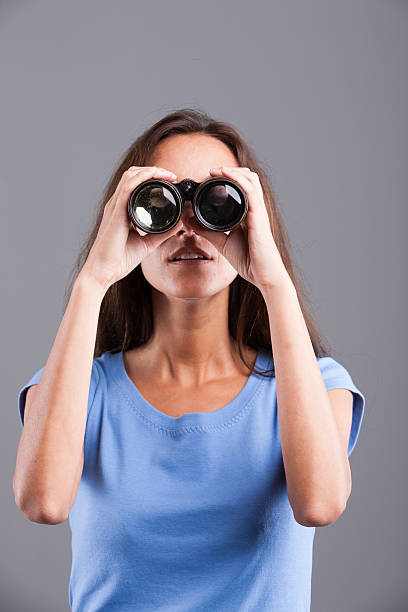 istock field glasses hold by a slim woman 520093988