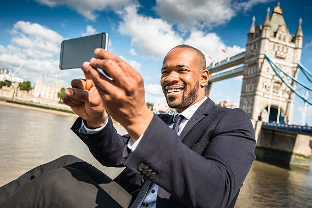 istock Business man take a selfie at tower bridge in London 520096090