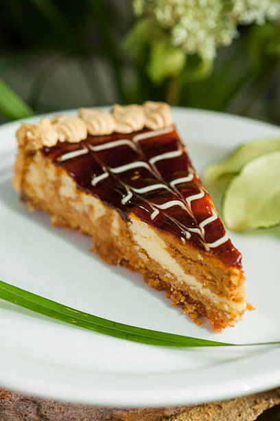 istock piece of cake with fruit jam, topped with whipped cream 520098468