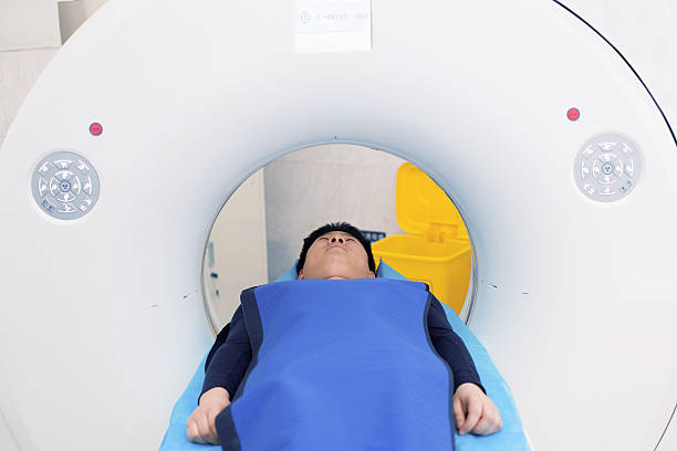 istock Men receiving an MRI Scan 520098718