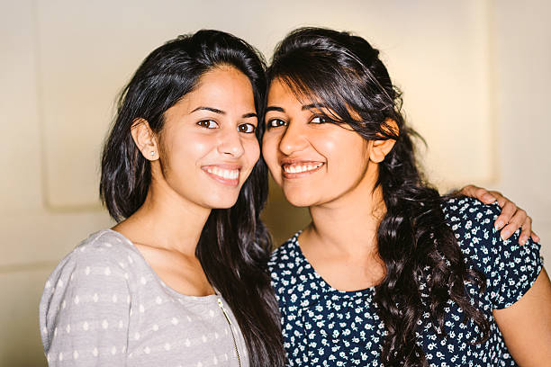 Radiant smiles reflect the close relationship of the women, their affinity shining through