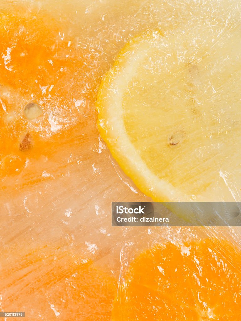 chunks of lemon and orange natural yellow popsicles with chunks of lemon and orange Backgrounds Stock Photo