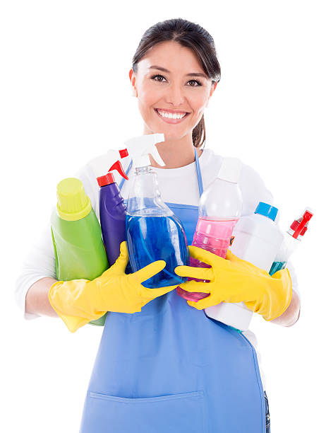 istock Housewife holding cleaning products 520115325