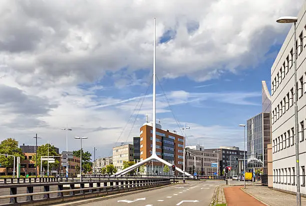 Thin white steeple on one of the crossroads of Eindhoven, Netherlands