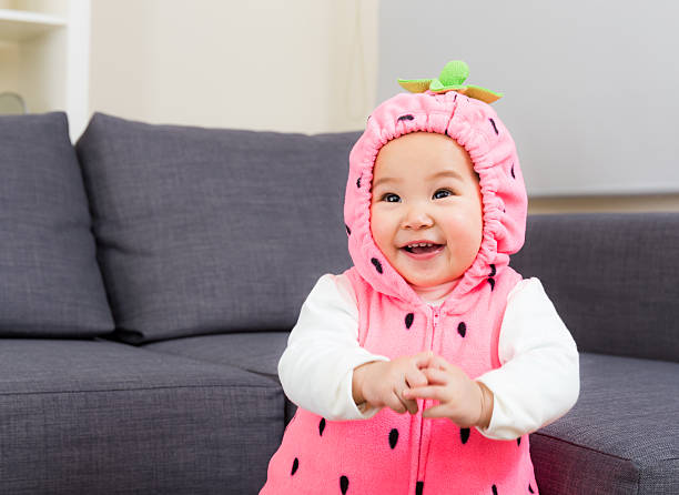 baby mit erdbeer-kostüm - korea child baby asian culture stock-fotos und bilder