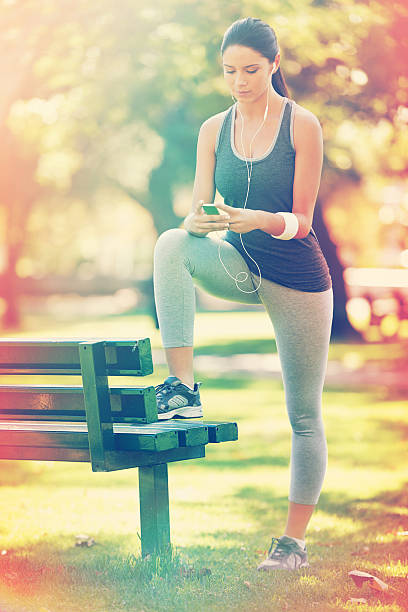 istock One last playlist check before she hits the track 520117425