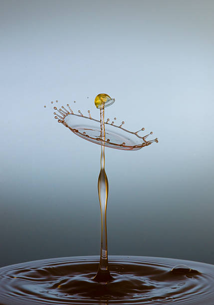 istock Water Droplet Collision creating fantastic colurful shape 520119077