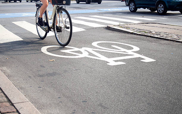 istock Bike lane and traffic 520120101