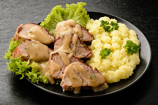 istock Baked tenderloin with mushroom sauce and mashed potatoes. 520122534