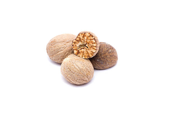 Nutmeg isolated on white background stock photo