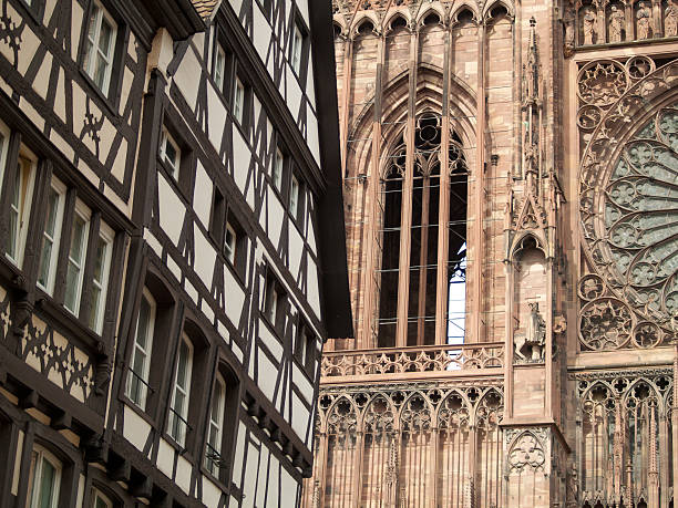 Close up of four statues engraved on Strasbourg cathedral.