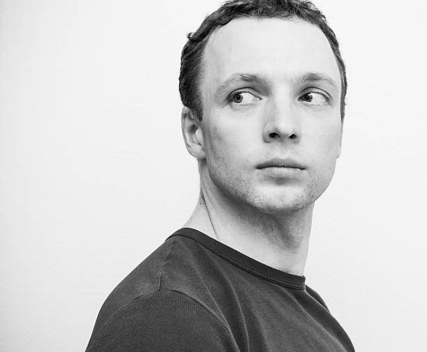 istock Young serious Caucasian man, closeup portrait 520123496