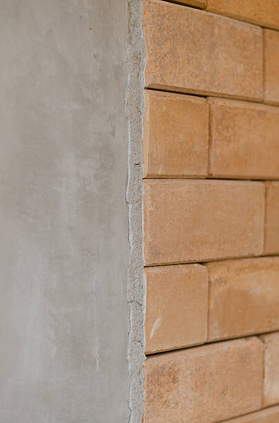 istock difference of concrete wall and red brick wall 520124434