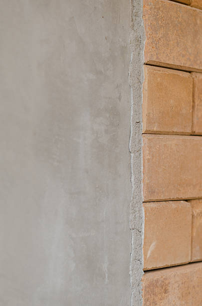 istock difference of concrete wall and red brick wall 520124598