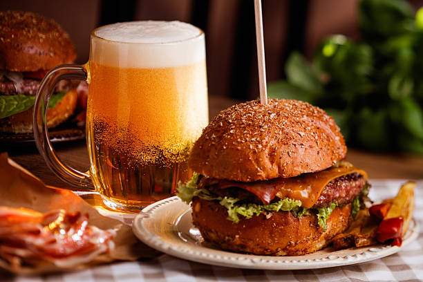 dinner with burger and beer stock photo