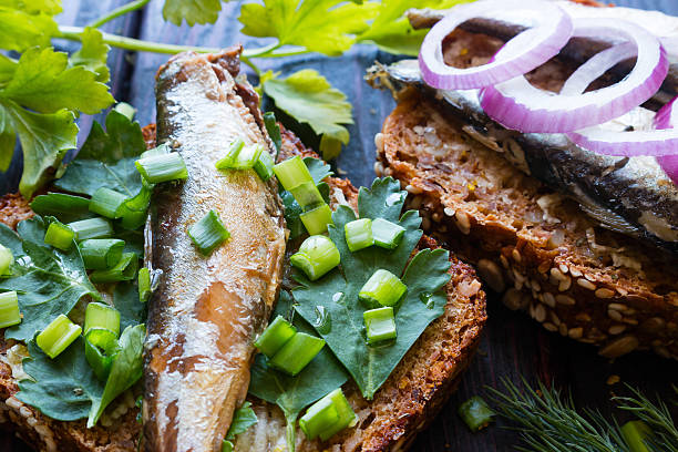 istock sardines on parsley leaves sprinkled with onion closeup 520128470