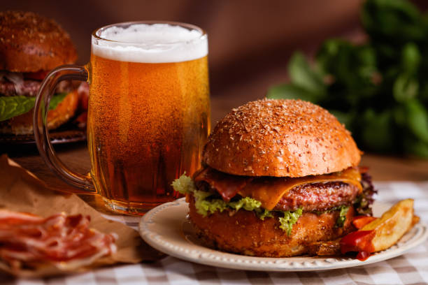 dinner with burger and beer stock photo