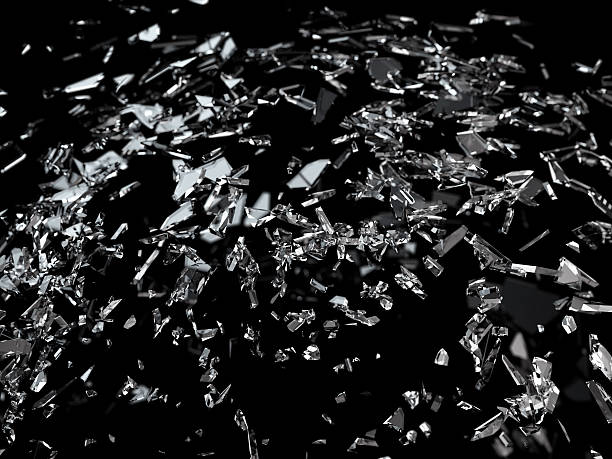 istock Pieces of splitted or cracked glass shallow dof 520129410