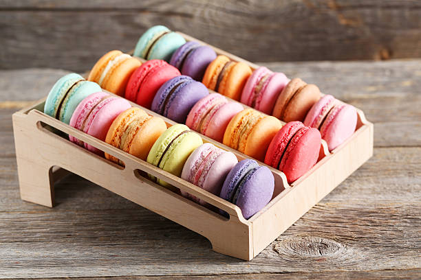 istock French colorful macarons on the wooden stand 520129450