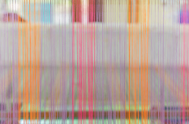 istock Weaving loom and shuttle on the warp 520129696