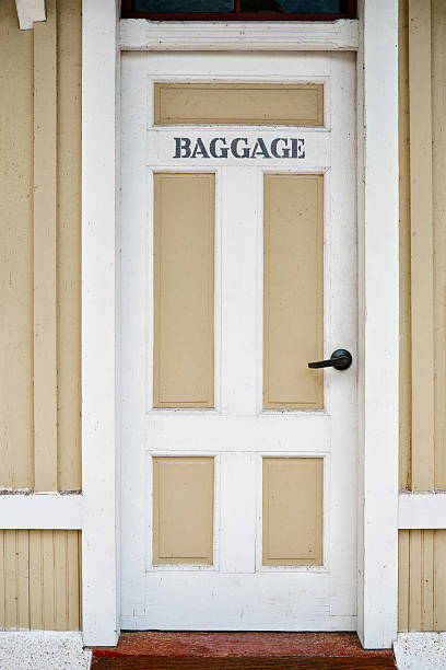 istock Word Baggage stenciled on a wooden door 520131071