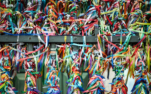 The railings of the Church of Senhor do Bonfim in Salvador, Brazil, adorned with wish ribbons left during the Festa do Bonfim celebrations.
