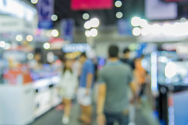 istock Abstract of blurred people walking in shopping centre 520132200