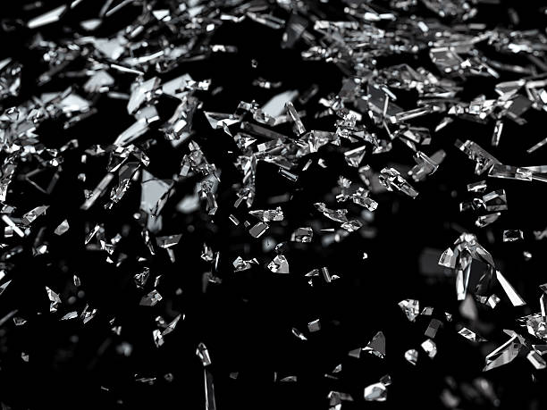 istock Pieces of shattered or cracked glass with shallow dof 520132424