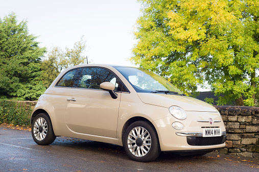Kendal, UK - October 12, 2014: A new Fiat 500 parked in Kendal, UK. This popular small car is manufactured by Italian Fiat, with headquarters in Turin, Italy.