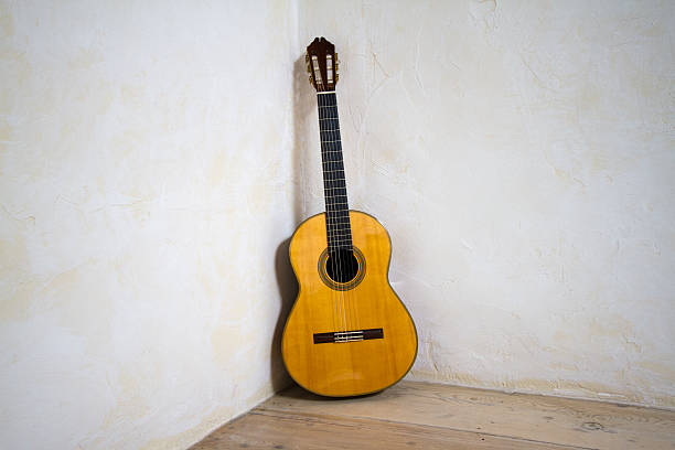 istock Vintage Classical Accoustic Guitar Leans in Corner 520133047