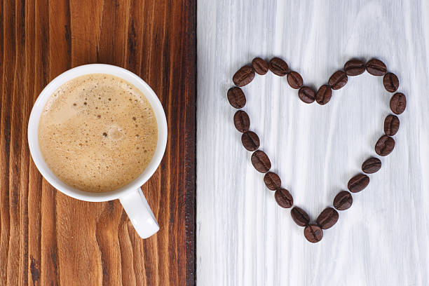 istock coffee and heart from beans on a wooden surface 520133299