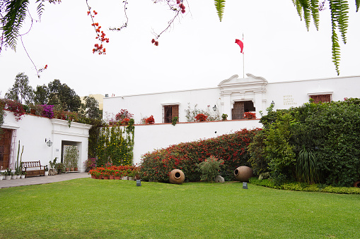 Pueblo Libre District, Lima, Peru. July 8,2014: Courtyard and gardens of the Larco Museum. The entrance to the exhibits area can be seen in the background.