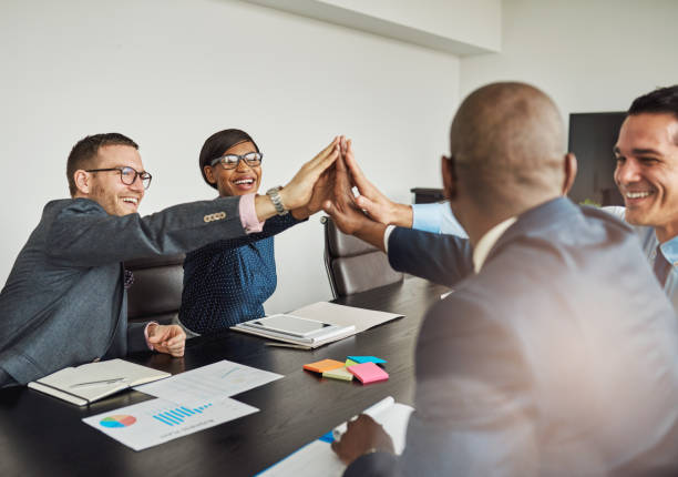istock Jubilant multiracial business team cheering 520134090
