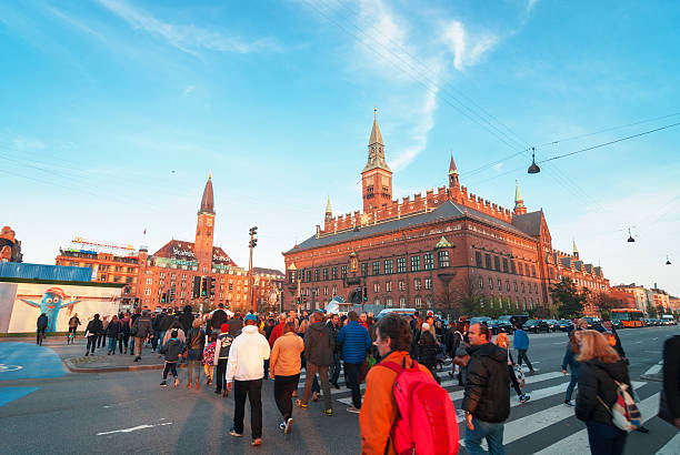 Copenhagen City Hall Copenhagen, Denmark, october 10, 2014: Very crowded City Hall Square in centre of Copenhagen. Copenhagen City Hall (Københavns Rådhus) is the headquarters of the municipal council as well as the Lord mayor of the Copenhagen Municipality. Pedestrian crossing in the picture is situated at H. C. Andersens Boulevard. It is the most densely trafficated artery in central Copenhagen. town hall square copenhagen stock pictures, royalty-free photos & images