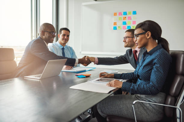 istock Two business teams reaching an agreement 520134618