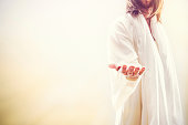 istock Jesus Christ Extending Welcoming Hand 520135495