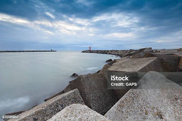 Jetty At The Entrance Of Scheveningen Harbor Stock Photo - Download Image Now - Beacon, Blurred Motion, Building Exterior