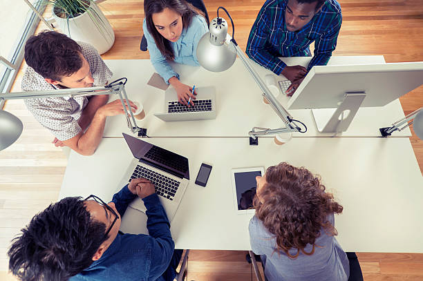istock Team of young business people using technology in a meeting 520136037