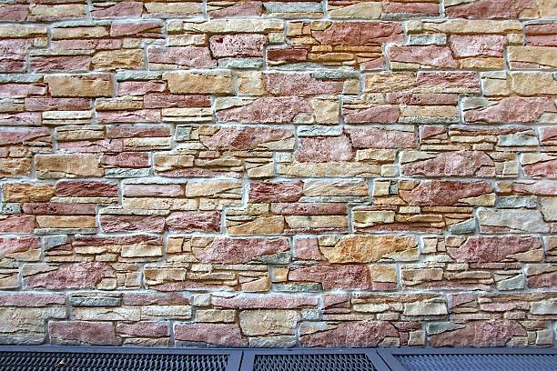 istock Home Exterior With Stone Wall and Metal Grid Floor 520136595