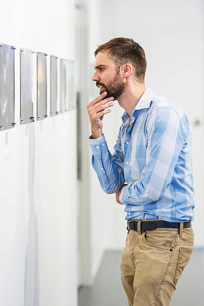 istock Hipster Man Visiting an Art Gallery 520136832