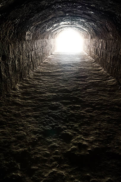 istock Light in the end of the dark tunnel 520137186